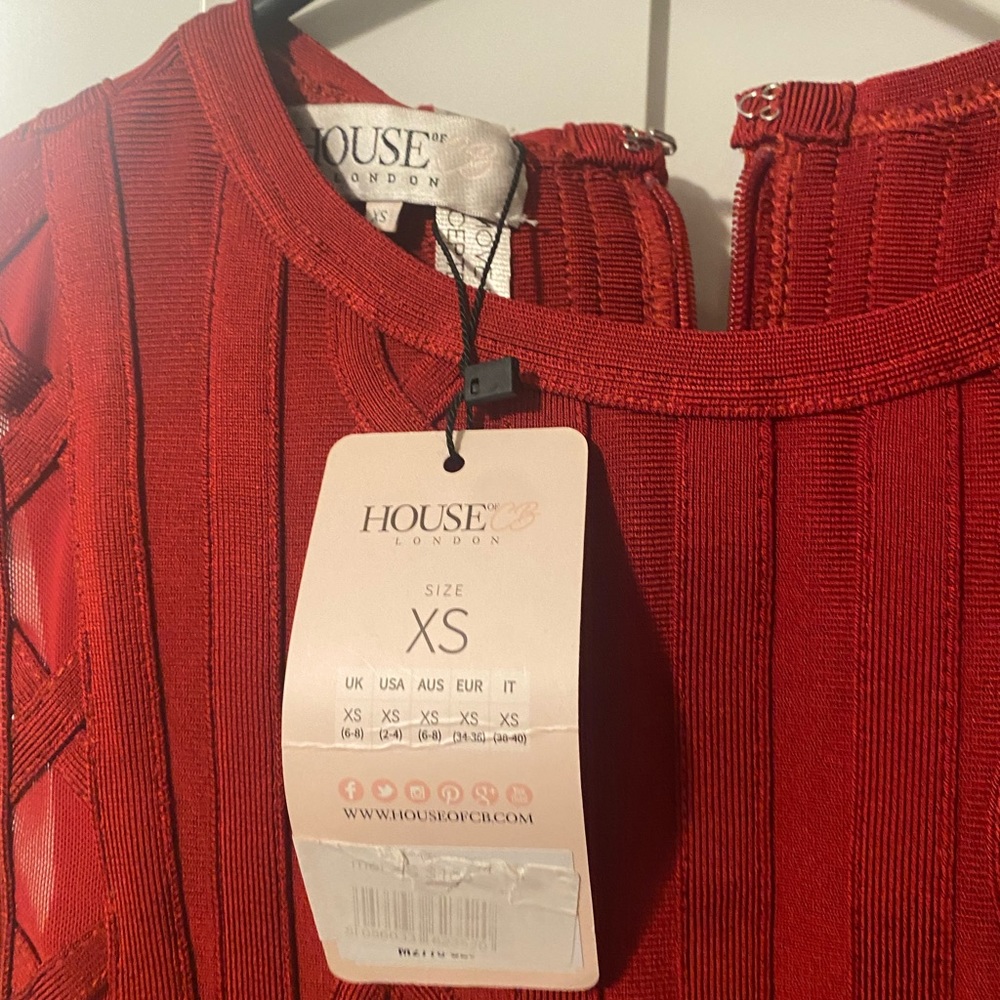 Red house of CB dress. Above the knees. Sides are see through